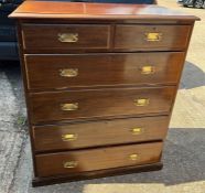 Two over four chest of drawers with brass swan handles