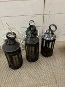 Four candle lanterns, three have been converted