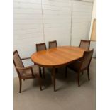 A Mid Century G Plan extending dining room table with six chairs