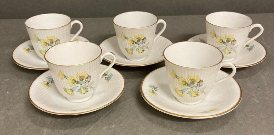 A set of five Rostrand coffee cups and saucers