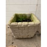 A square planter in the form of a stones