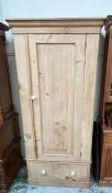 A pine single wardrobe with white knob handles (H200cm W95cm D55cm)