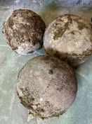 Three garden weathered spheres