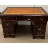 A pedestal desk with leather top and brass handles, stamped to drawers L. Pimm London(H76cm W120cm