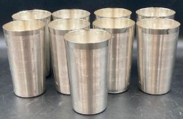 A set of nine solid silver beakers with a star design (Total Approximate Weight is 1305g)