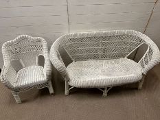 A white wicker sofa suite with one chair