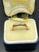 An 18ct gold ring with platinum setting Size L