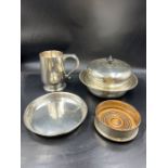 A selection of silver plate to include a wine holder, Harrods lidded dish etc