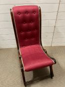 A mahogany frame slipper chair on castors