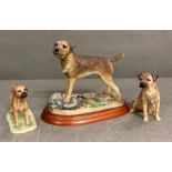 A trio of ornamental border terriers