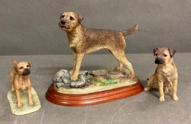 A trio of ornamental border terriers