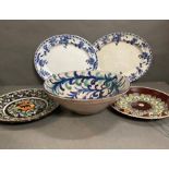 A mixture of five decorative plates and bowls