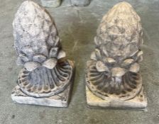 A pair of pineapple garden ornaments
