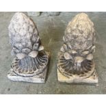 A pair of pineapple garden ornaments