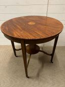 A circular mahogany table with inlay on tapering legs (H77cm Dia70cm)