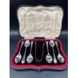 A cased set of six silver teaspoons and sugar nips, hallmarked for Sheffield 1901 by W S Savage & Co