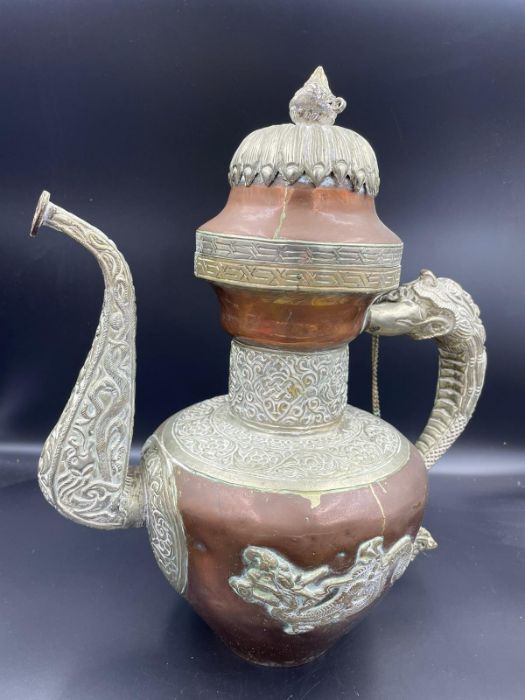 A Vintage Tibetan copper and white metal ewer