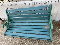 A Victorian style garden bench with cast iron ends