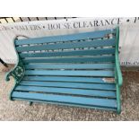 A Victorian style garden bench with cast iron ends