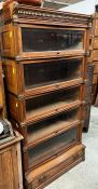 A Globe Wernicke bookcase, seven section with moulded cornice top and five glazed sections