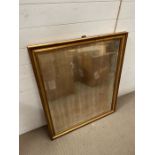 A gilt frame and foxed mirror (86cm x 104cm)