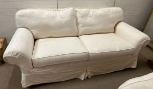 A Multi York sofa suite comprising of a three seater white sofa with removable covers and a two