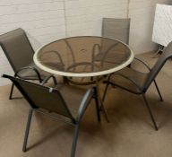 A four seater Mid Century style black marble and chrome kitchen table and string chairs (H73cm