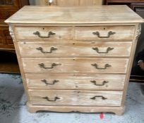 A two over four washed pine chest of drawers (H123cm W124cm D57cm)