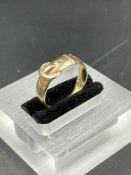 A 9ct gold buckle ring, size P (Approximate Weight 3g)