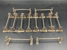 A set of twelve Indian silver knife rests