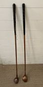 Two vintage wooden golf clubs