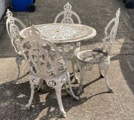 A aluminium garden table and four chairs.