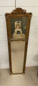 A gilt framed hall mirror with seated young girl