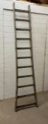 A vintage wooden Y frame ladder