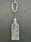 An Asprey, engraved silver bottle shaped key ring.