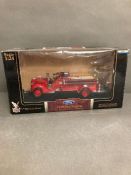 A boxed Diecast Ford 1938 fire engine