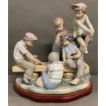 A large Nao figurine "Boys Playing Cards"