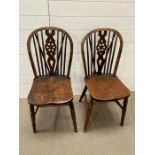 A pair of wheel back chairs