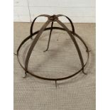 An antique metal meat hanger