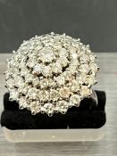 A 1950’s Diamond ring, with a total weight of approximately 12.6g comprising 71 diamonds, the centre