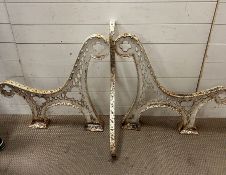 A pair of cast metal bench ends original Victorian/Edwardian, middle stretcher painted white,