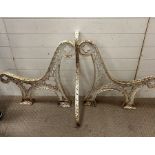 A pair of cast metal bench ends original Victorian/Edwardian, middle stretcher painted white,