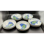 Thirteen ceramic bowls with crap/fish decoration stamp to base