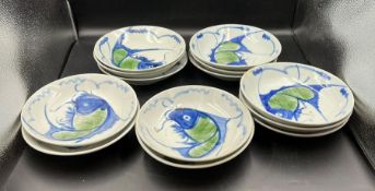 Thirteen ceramic bowls with crap/fish decoration stamp to base