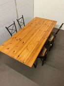 A pine dining table on metal legs and four chairs (180cm x 78cm x 72cm)