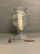 A storm lamp with candle snuffer
