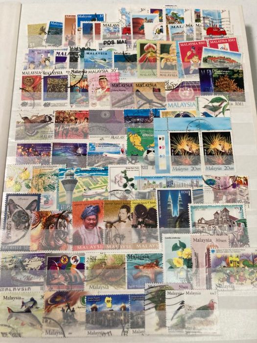 Two World stamp albums focussed on Asia, Europe and Africa