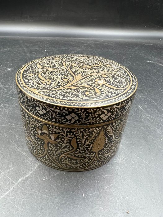 An inlaid metal pot