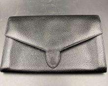 A Smythson travel wallet in black leather.