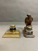 A wooden eagle inkwell and a brass inkwell